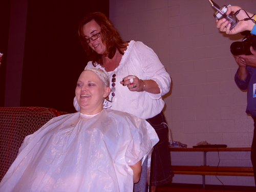 Ms. Meurs getting her head shaved.