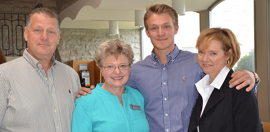 John Szasz, second from right, with Dr. Margaret McNay, second from left, and his parents Steve and Laurie at the Pledge and Pin Ceremony.